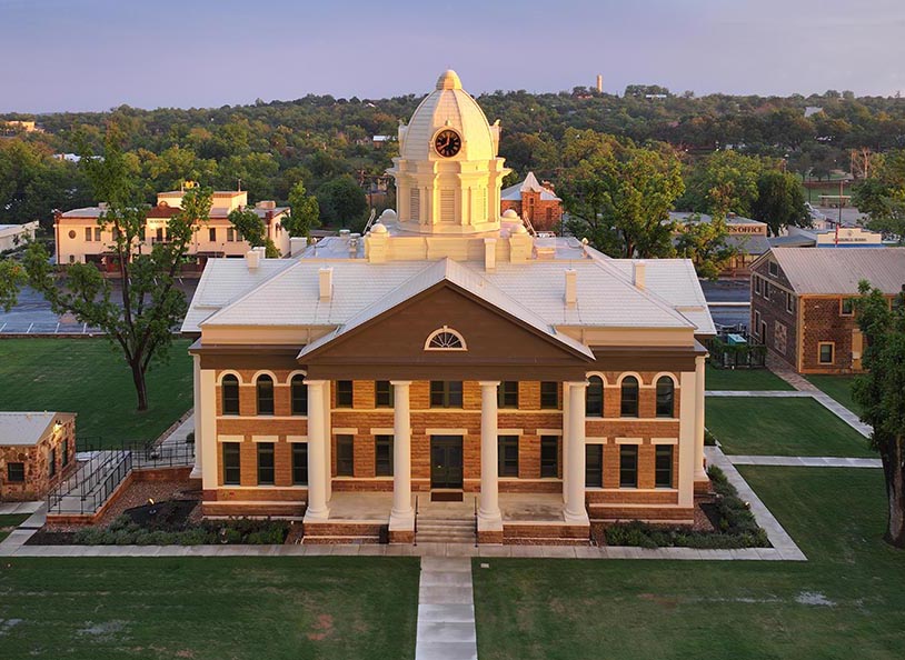 Silhouette map of the world showing all continents in dark teal